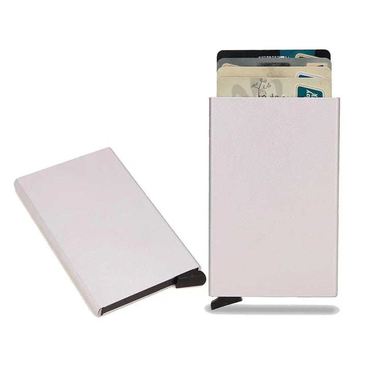 Open view of a men's metal wallet, showing card slots and RFID protection features