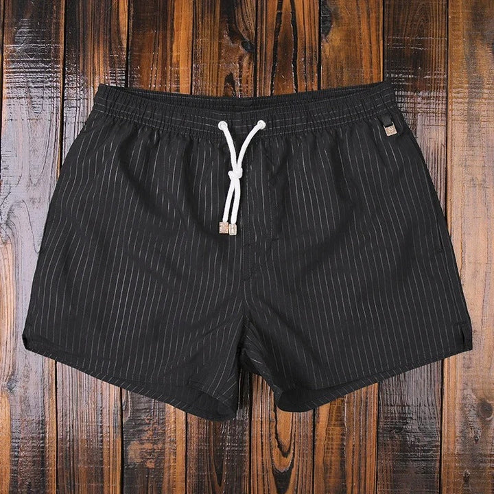 Striped men's leisure shorts, elasticated waist for easy fit, stylish summer clothing.