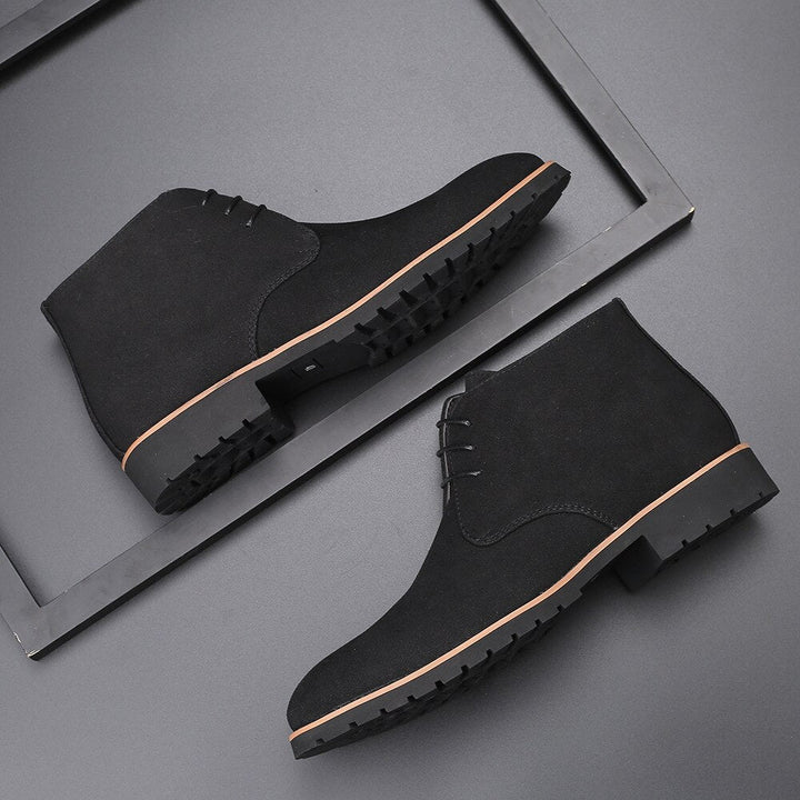Versatile men's black slip-on ankle boots offering comfort and style for everyday fashion.