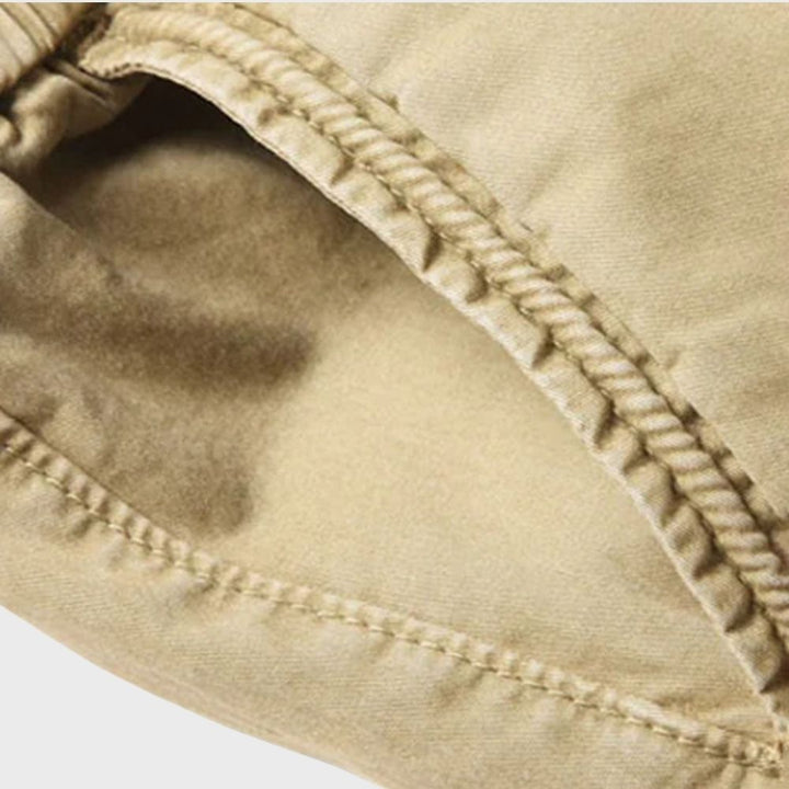 Durable men's cargo joggers, blending fashion, comfort, and practical utility pockets.