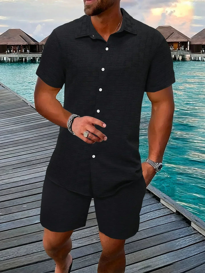 A man wearing a modern casual 2-piece outfit. Stylish and comfortable polyester blend set.