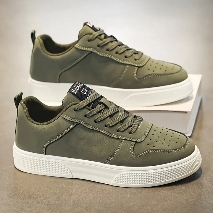 Men's lace-up grey suede hiking shoes, showcasing durable laces & secure fit for long outdoor treks.