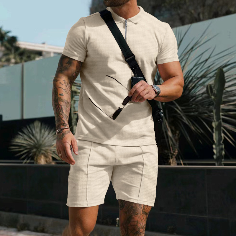 Comfortable men's two-piece summer set. Relaxed fit button-down shirt & shorts, ideal for beachwear & leisure.