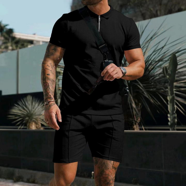 Warm weather men's outfit set: comfortable button-down shirt and shorts. Stylish leisure wear for summer fashion.