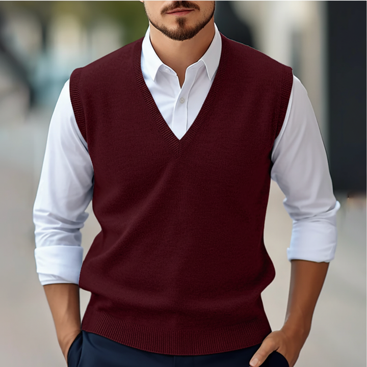 Men's tailored sleeveless knitted cotton V-neck gilet in black, perfect for smart casual layering.