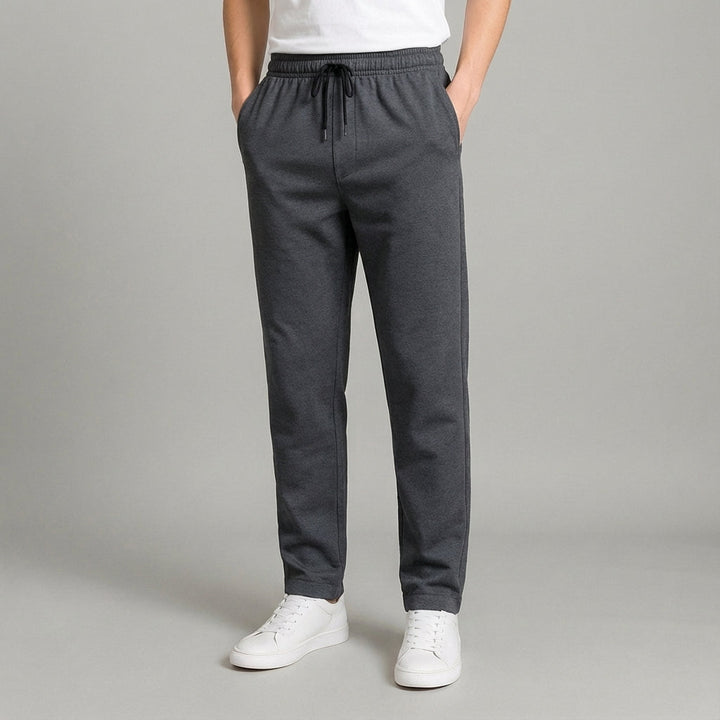 Men's tapered jogger pants in a group shot, displaying versatile color options for casual and sportswear.