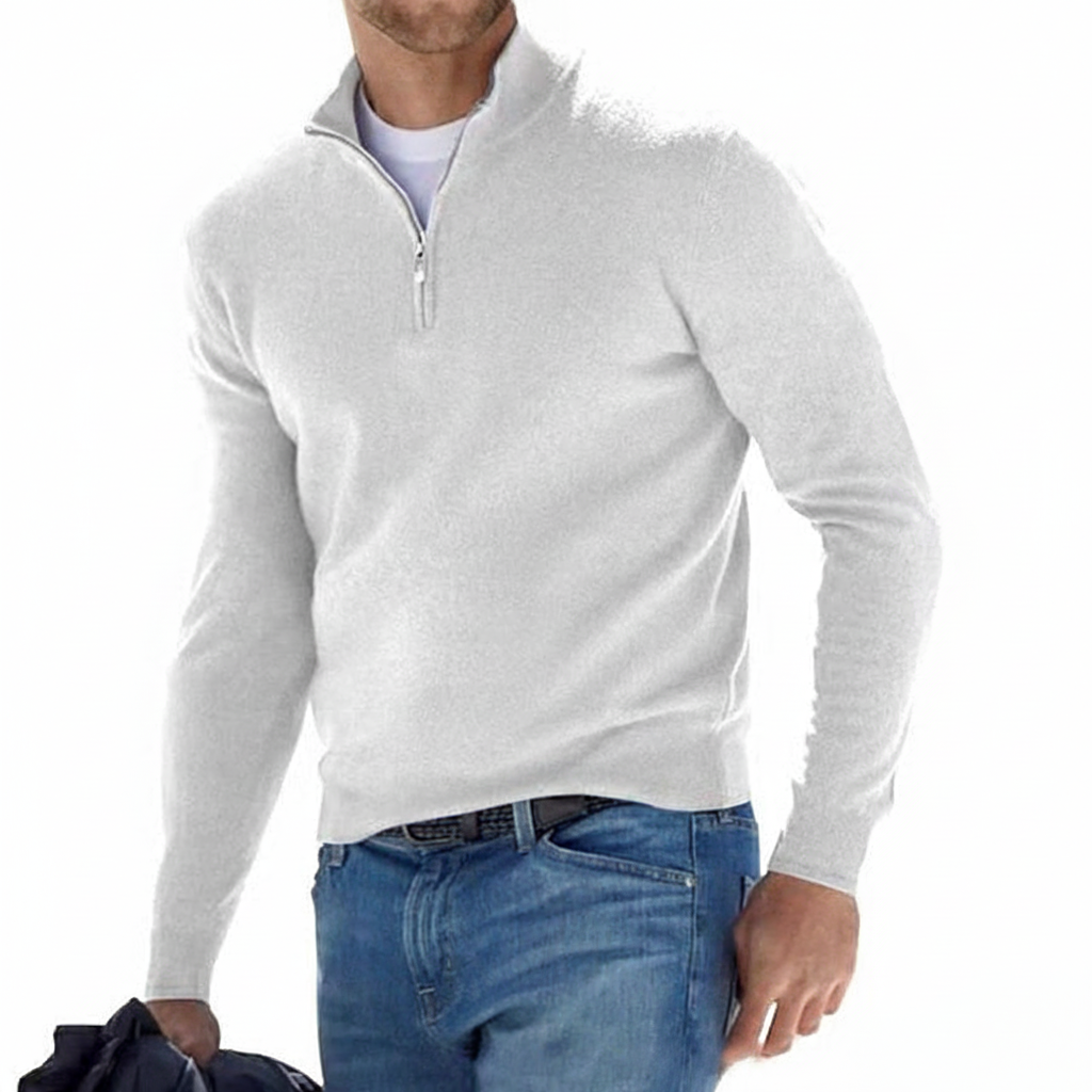 Detail shot of the soft faux merino fabric on a men's v-neck sweater with modern zip accent.