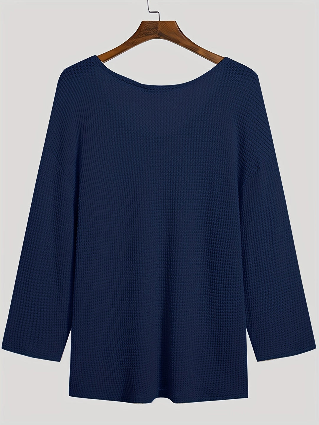 Modern men's V-neck knitted top with long sleeves, merging comfort with contemporary style.