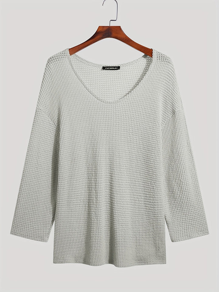 Eliott men's knitted V-neck top with long sleeves, offering breathable all-season comfort.