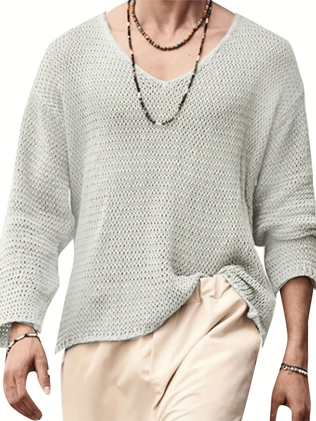 Stylish men's V-neck knitted top with long sleeves, ideal for layering or stand-alone wear.