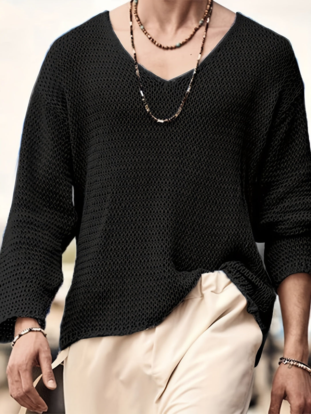 Breathable men's V-neck knitted long sleeve top, an essential for all season casual wear.