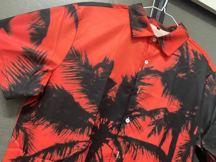 Casual men's short-sleeve tropical floral print button-up shirt. Ideal for summer fashion, beach, or vacation outfits.
