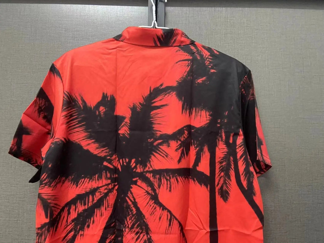 Trendy men's short-sleeve tropical print shirt. Vibrant summer fashion for vacation, beach, or festival outfits.