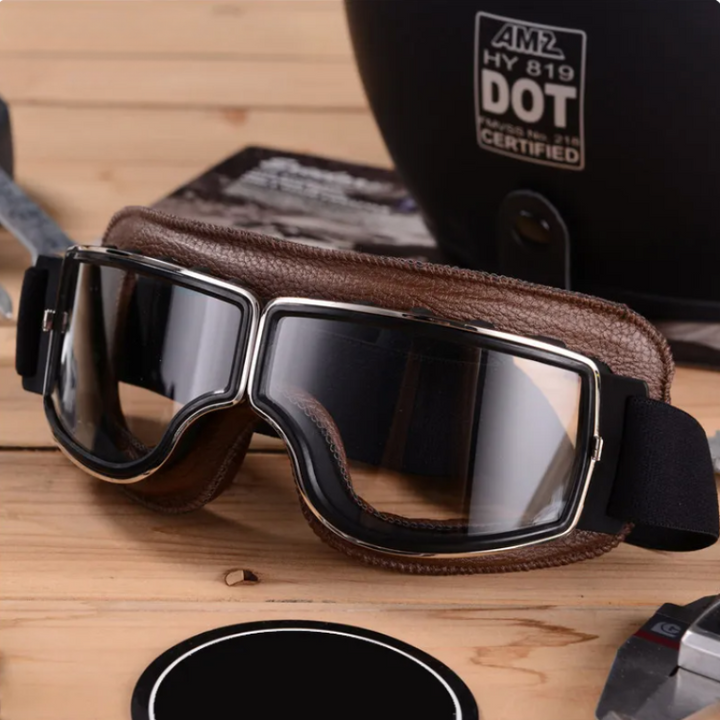 Men's vintage leather motorcycle goggles with chrome frame, perfect for retro biker gear & wind protection.