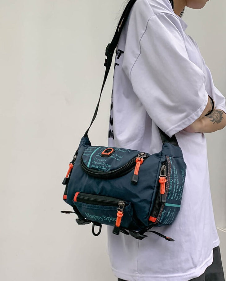 Black water-resistant sling bag with adjustable strap, ideal for men's travel and outdoor activities.