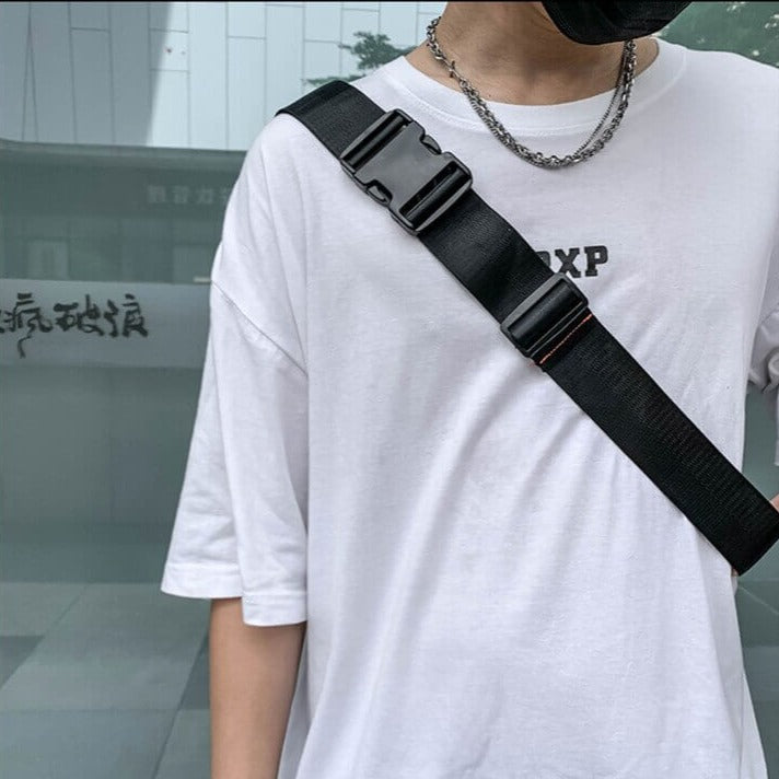 Close-up of durable water-resistant fabric on men's multi-way travel sling & waist bag.