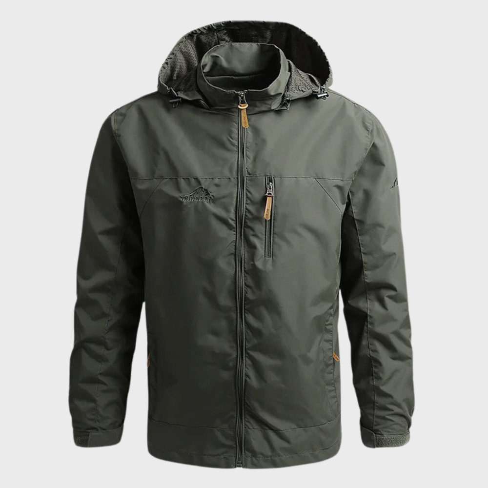 Man wearing a sleek ElementShield waterproof jacket, ready for diverse weather. Ideal men's rain jacket & windbreaker.