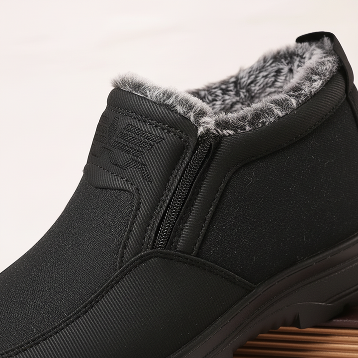 Men's insulated winter boots in snow, waterproof, providing cold weather protection