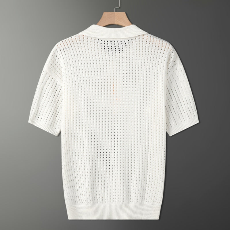 Comfortable men's white short sleeve knit polo with an airy texture, ideal for everyday summer wear.