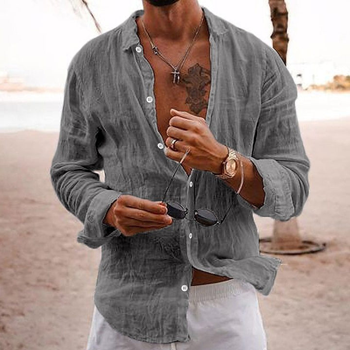 Model wearing a mens cotton long-sleeve summer shirt, styled casually for a relaxed outdoor look.