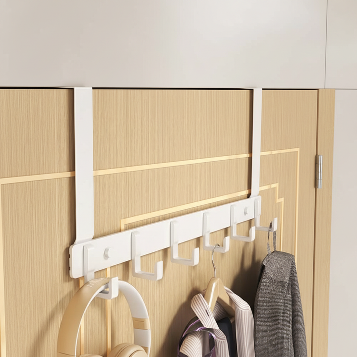 Metal over-the-door hook rack with 5 hooks on a white door, space-saving storage