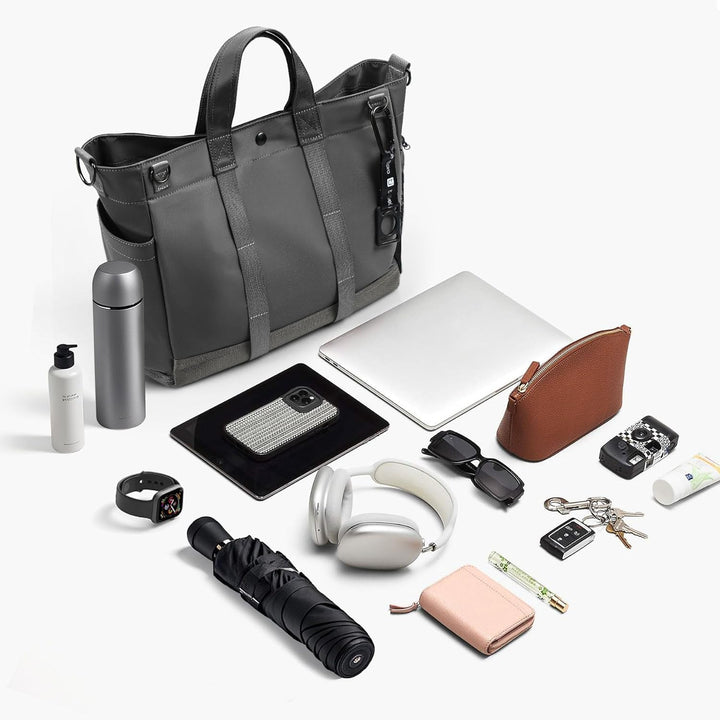 Black MetroCarry tote bag for laptops, featuring a spacious multi-compartment design and adjustable strap.