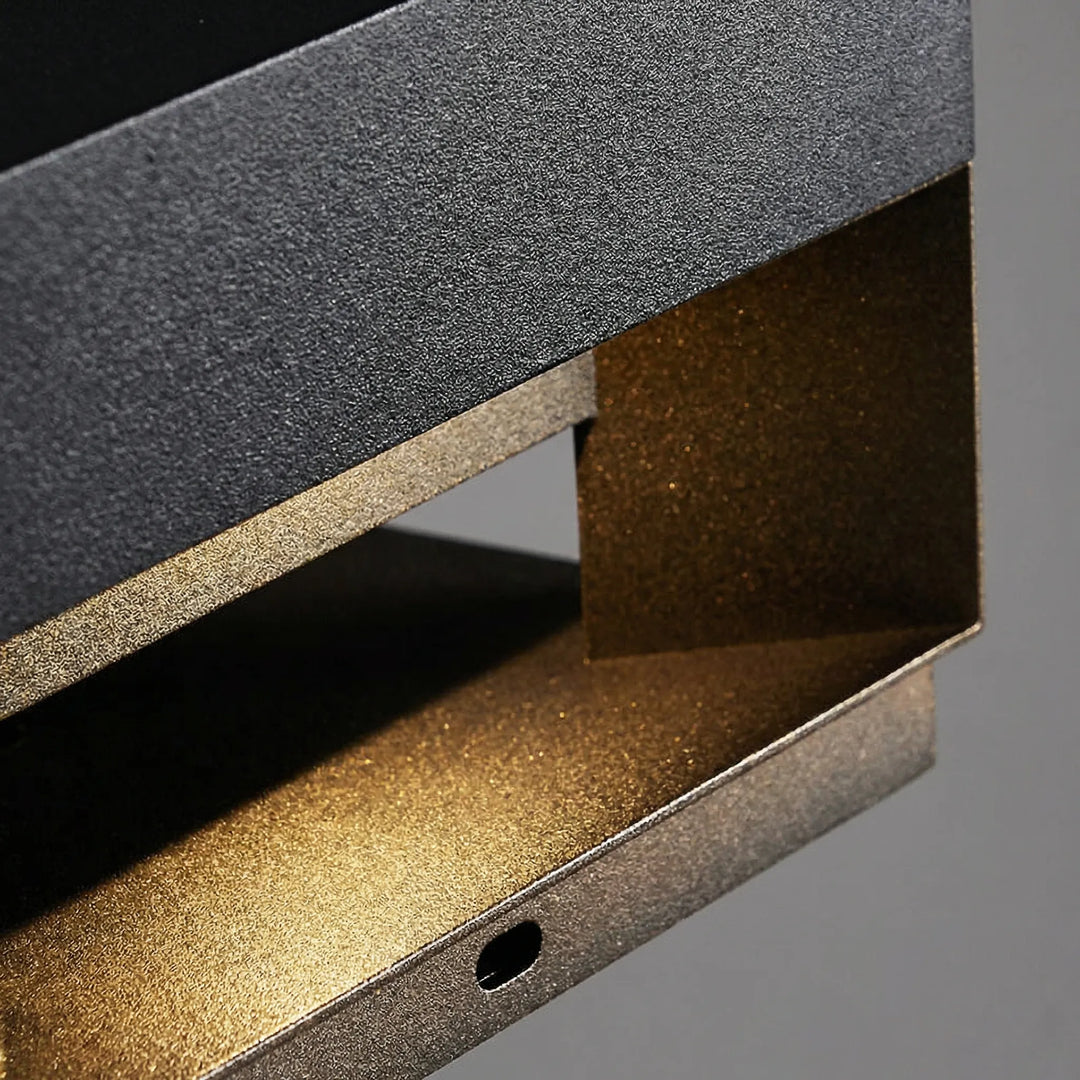 Modern square LED outdoor light, ideal for illuminating pathways or garden walls.