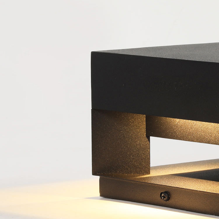 Close-up of minimalist square LED outdoor light, showing durable, weatherproof construction.