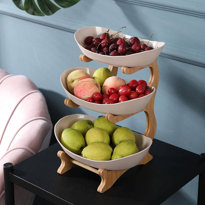 Contemporary 2-tier metal fruit stand, enhancing kitchen decor while organizing fruits, vegetables, & snacks.