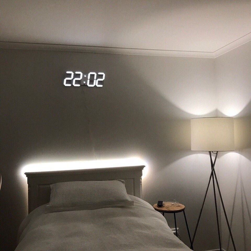 Modern large 3D LED wall clock, dimmable & digital, perfect for a statement in any room.