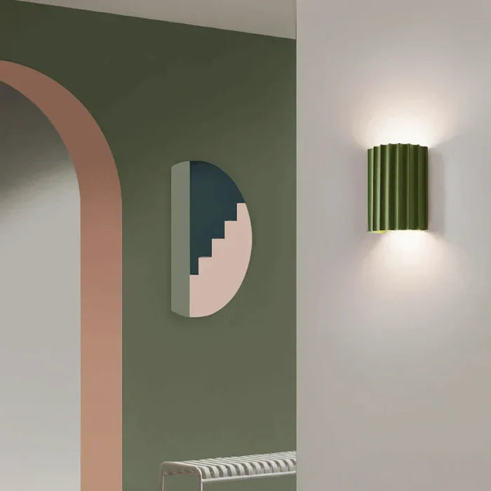 Contemporary resin wall sconce, provides stylish indirect LED light.