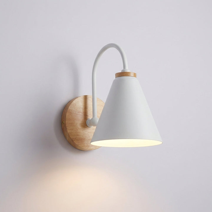 Minimalist black metal downward cone wall lamp with a light wood base, ideal for ambient illumination.