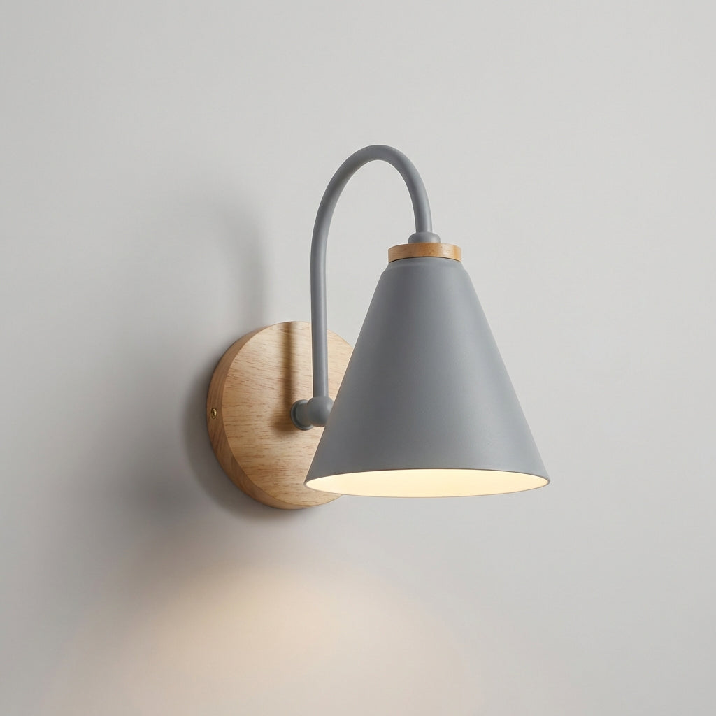 Architectural modern lighting: a downward cone wall sconce in metal with an integrated wood element.