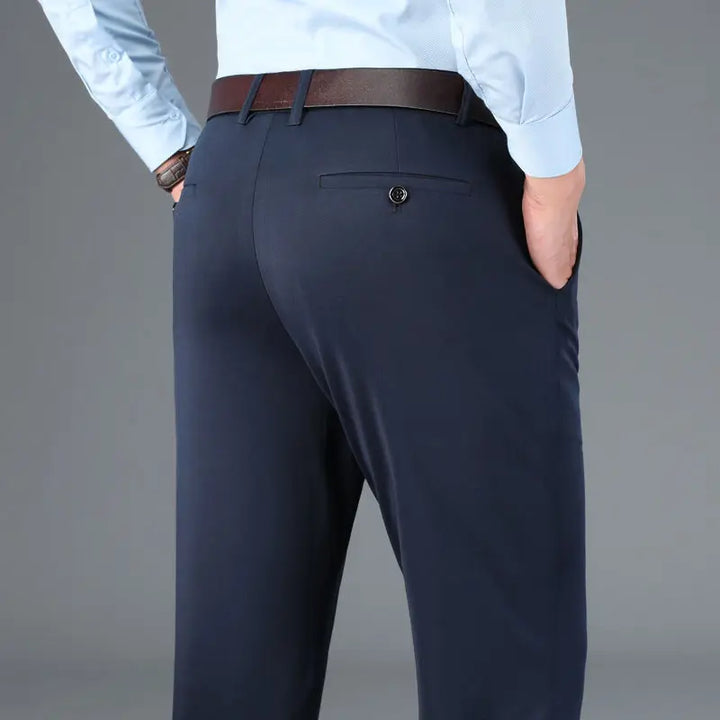 Close-up of men's stretch trousers fabric, showcasing flexible, comfortable material & modern design.