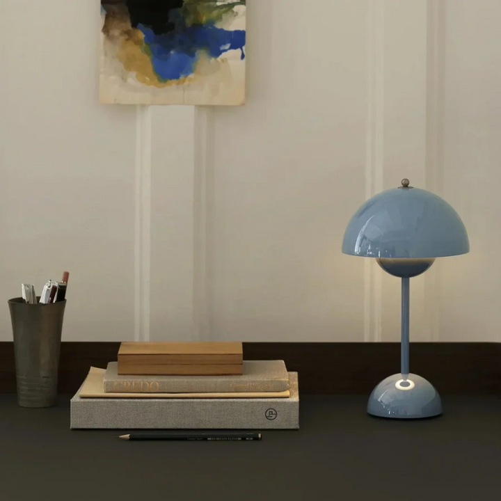 Stylish accent light, a touch control desk lamp, enhancing a bedside table.