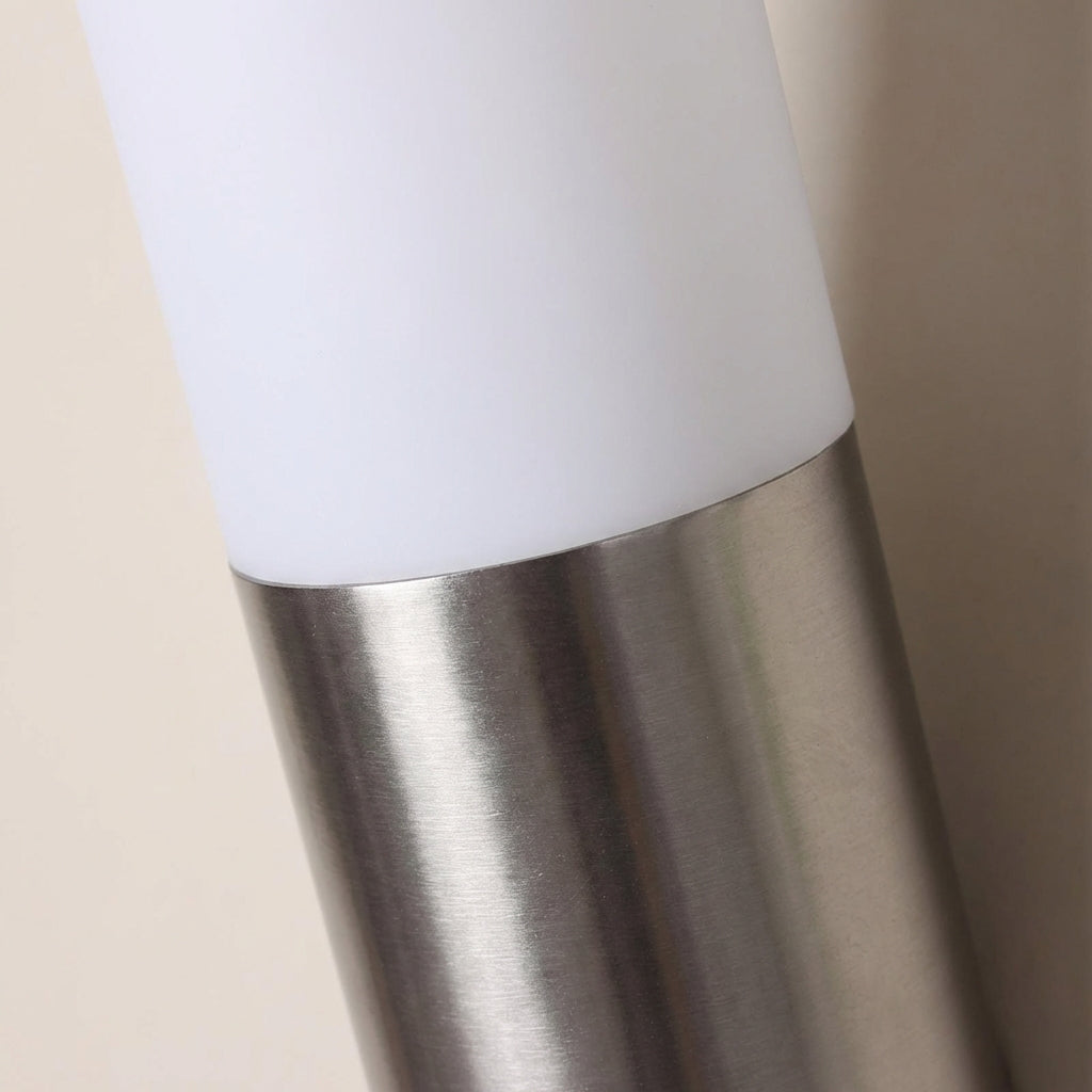 Contemporary weatherproof LED wall light with integrated motion sensor, perfect for modern home exteriors.