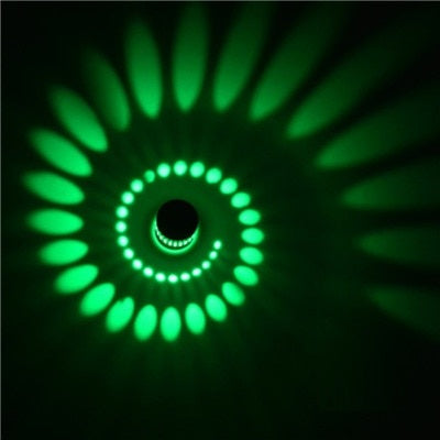 Close view of the intricate spiral pattern of the LED wall lamp, artistic lighting