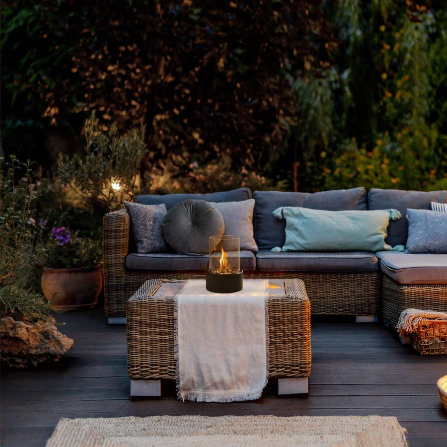 Contemporary tabletop fire pit for patio lighting and outdoor ambiance. Portable modern design.