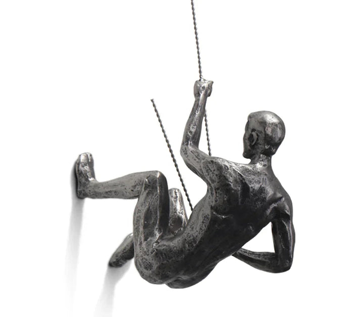 Modern resin climber wall sculpture, unique inspirational home decor art piece for contemporary interiors.