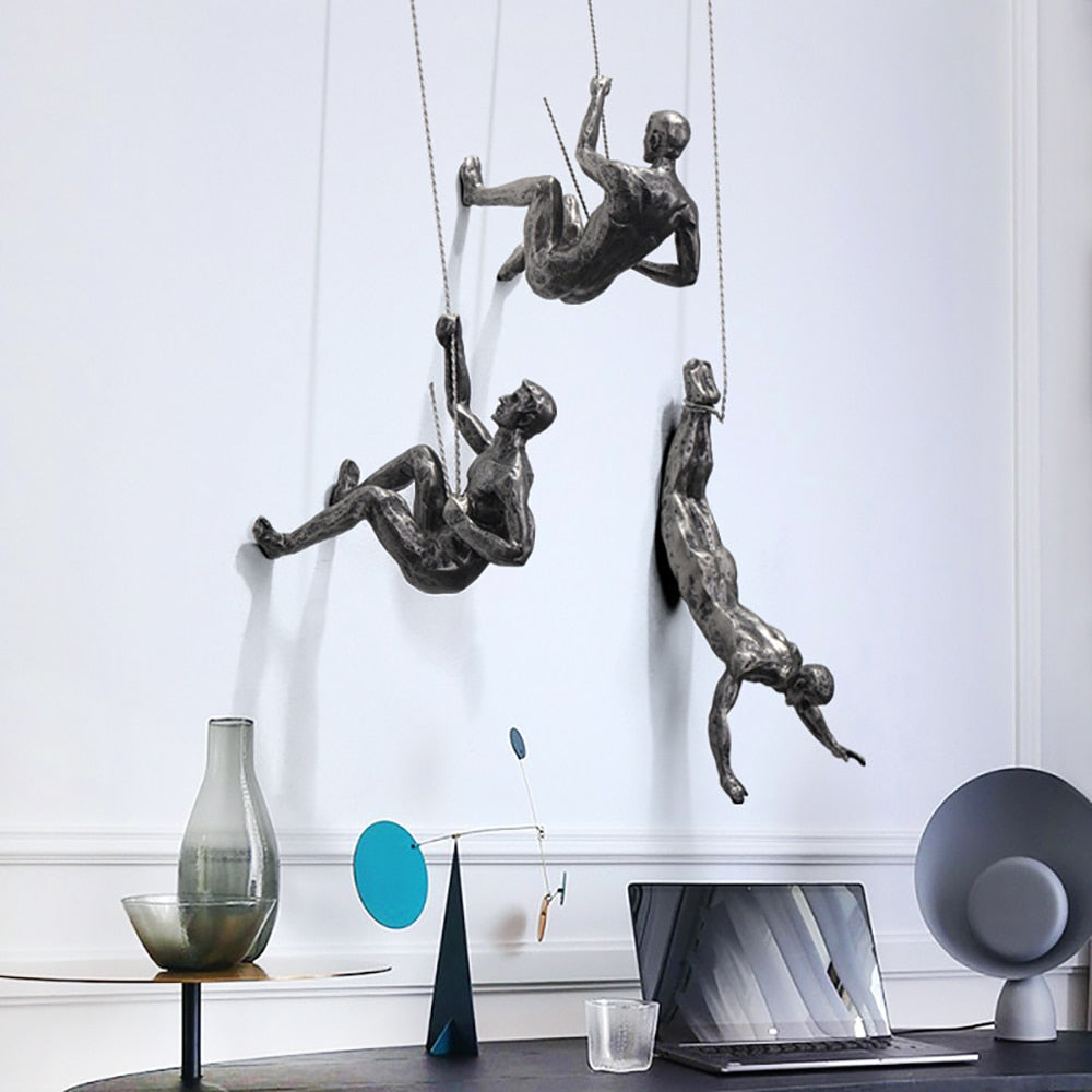 Abstract climber wall art sculpture, inspiring modern home decor resin piece for contemporary interior design.
