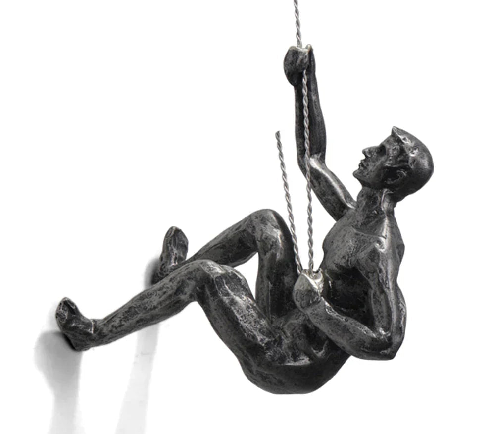Inspirational climber wall art sculpture, elegant resin design for modern home decor and interior styling.