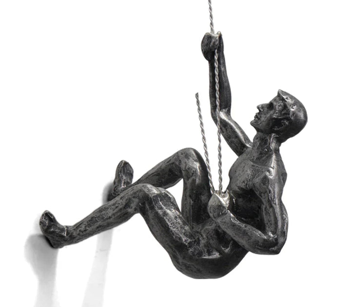 Inspirational climber wall art sculpture, elegant resin design for modern home decor and interior styling.