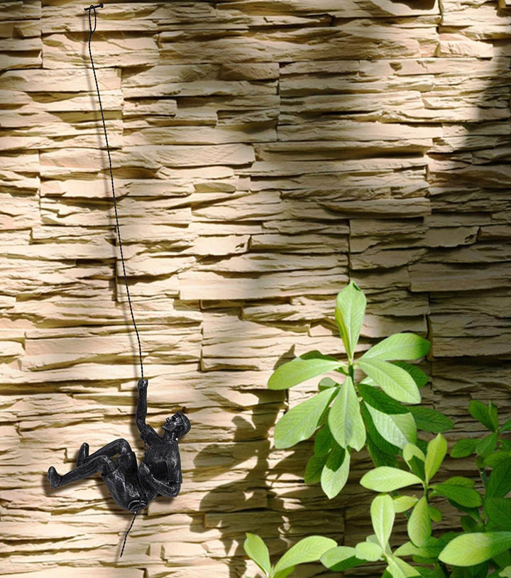 Resin climber wall art sculpture, contemporary home decor piece for inspiring modern interior design.