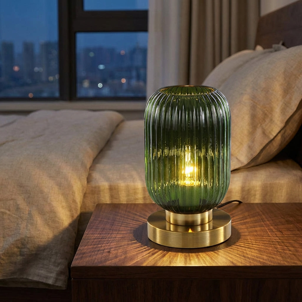 Modern ribbed glass table lamp, Glintora, with clear glass and metal base, perfect for ambient lighting.