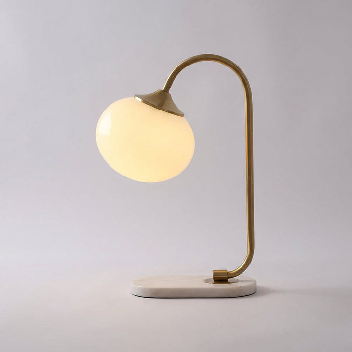 Melluma modern rounded table lamp, sleek design. Ideal bedroom or living room decorative lighting solution.