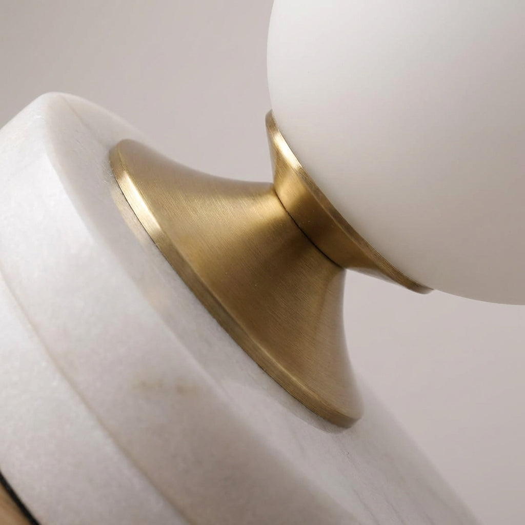 Close-up of a Melluma modern rounded glass table lamp, showcasing its unique and contemporary design.