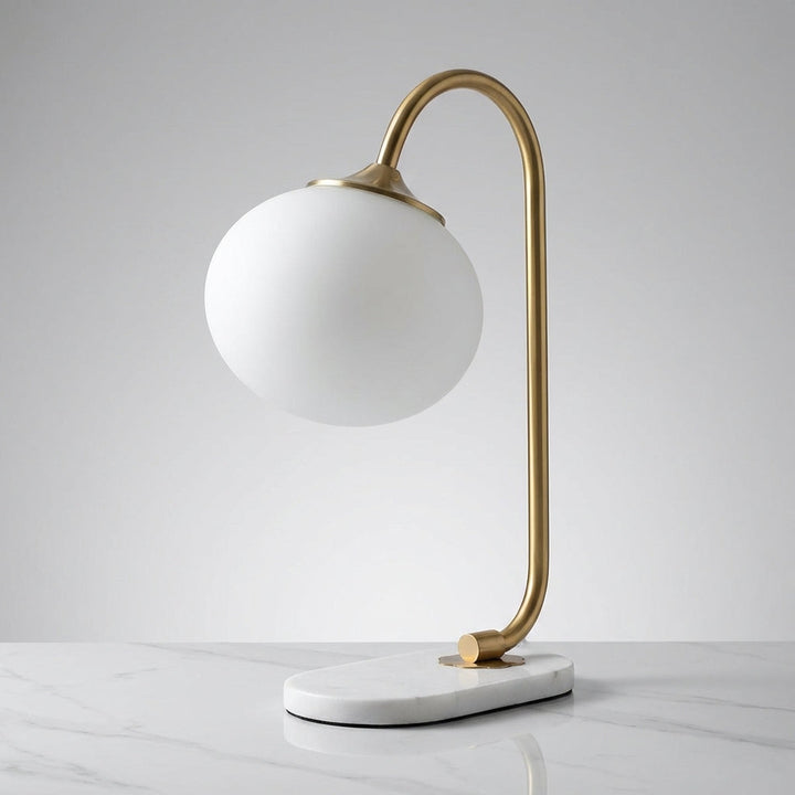 Melluma glass and metal modern rounded table lamp, an eye-catching piece for living rooms and offices.