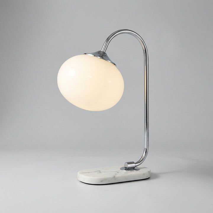 Melluma modern rounded table lamp from a top-down view, highlighting its smooth, minimalist form.