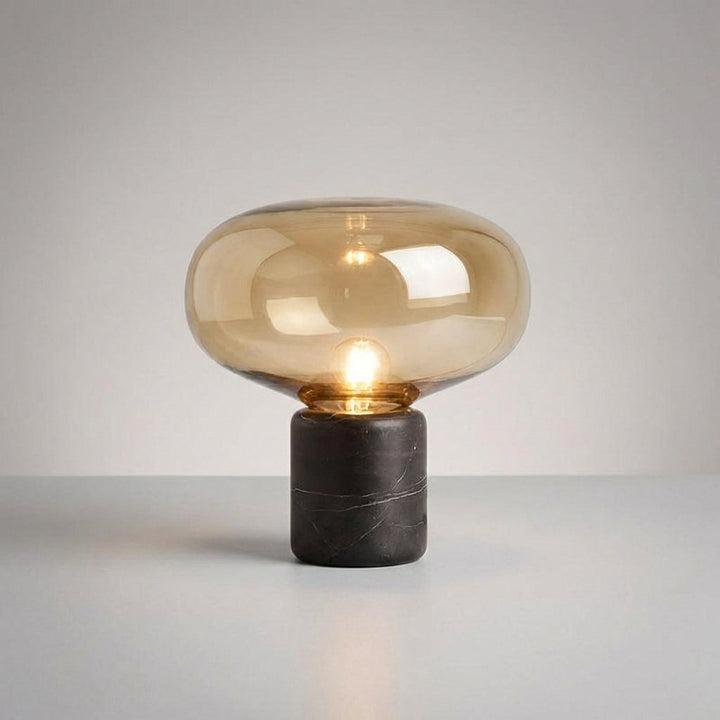 Contemporary Aurablock table lamp featuring a sleek sculptural body and natural marble base.