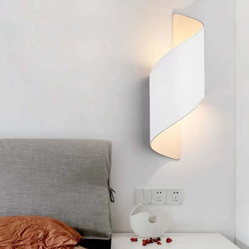 Contemporary outdoor spiral LED wall light, TwistLight, illuminates entryways.